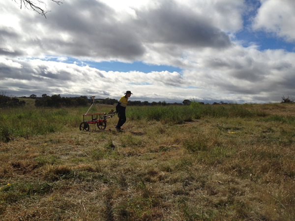 The single EM61 being pulled over a test pit.